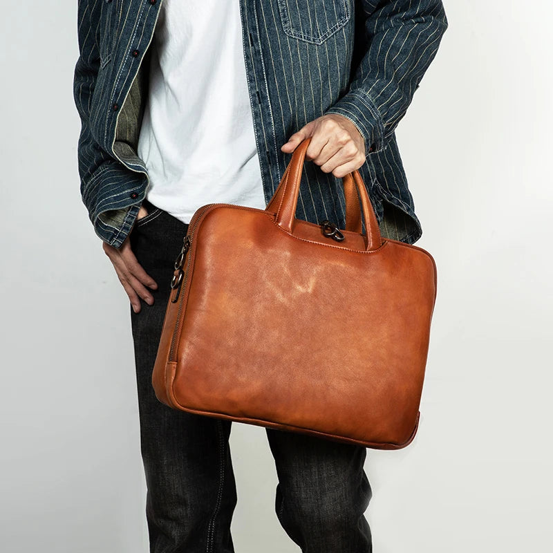 Luxury handcrafted vegetable-tanned leather briefcase for men, perfect for business and laptop use, with a vintage design and st